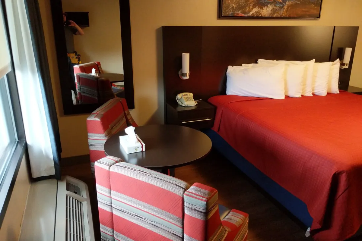 Accessible king room with seating area and wide clear floor space