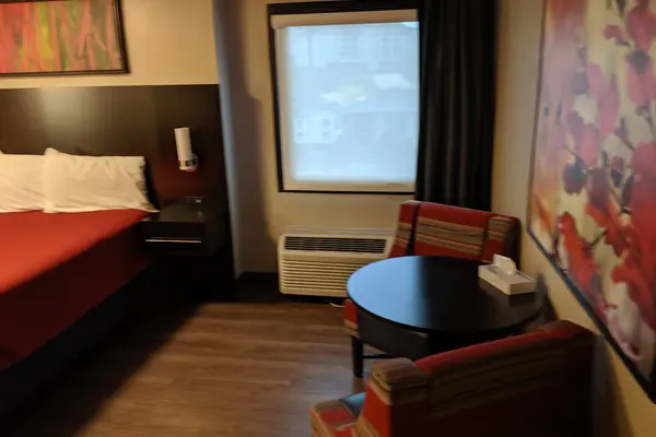 King bed with window and table in the accessible room