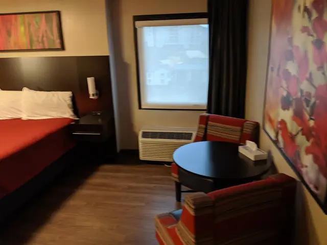 King bed with window and table in the accessible room