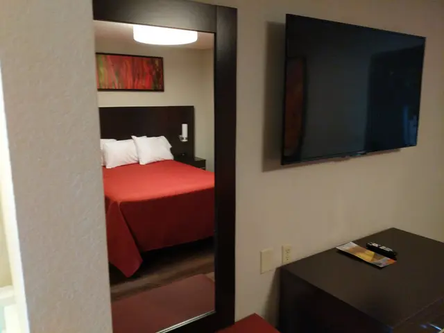 King bed, dresser and flat-screen TV