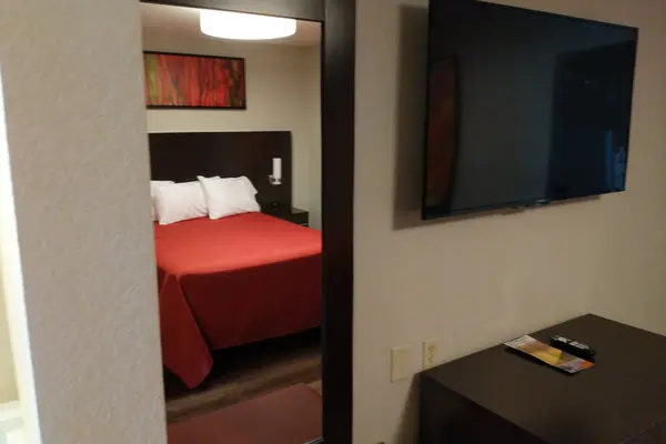 King bed, dresser and flat-screen TV