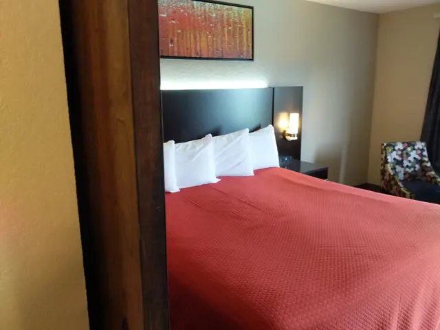 King bed with modern headboard lighting